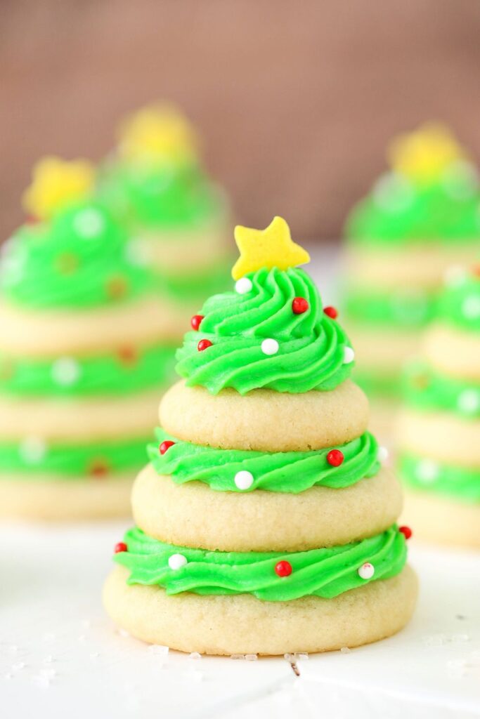 Christmas Tree Cookie Stacks with a star on top and round ornament sprinkles all over it