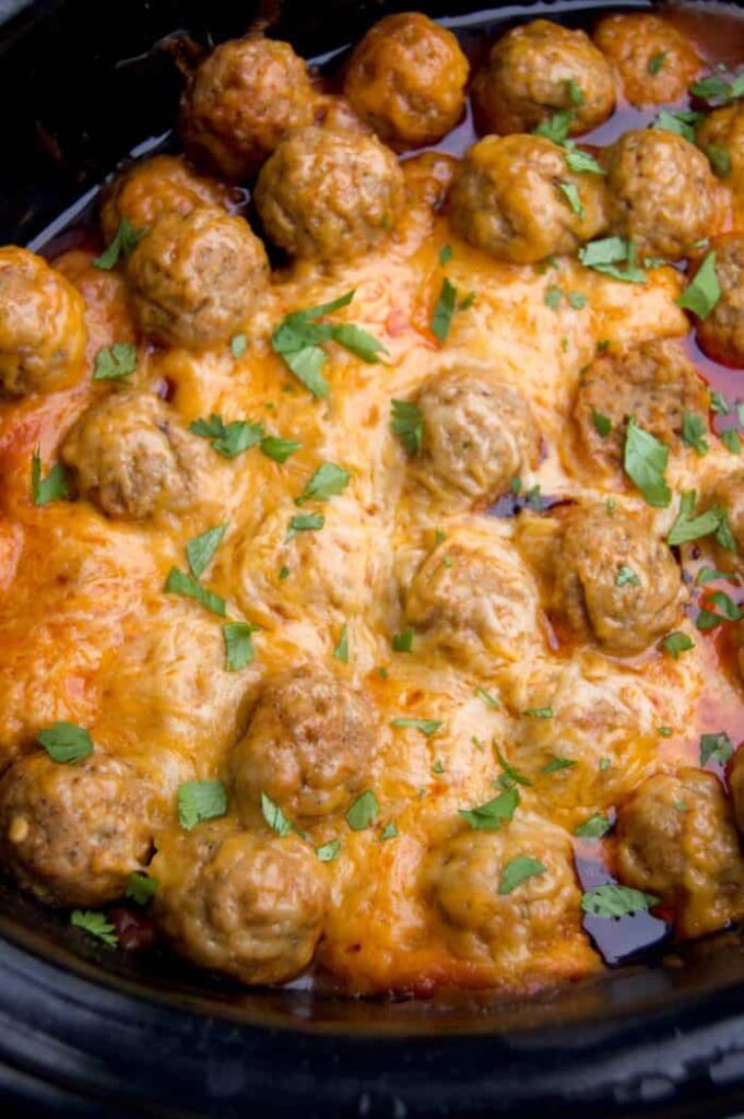 Slow Cooker Enchilada Meatballs perfect appetizer or served them over rice for an easy Fall dinner 