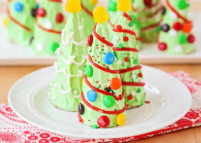 Waffle cone Christmas tree decorated with small candies and yellow Gum Drop on top
