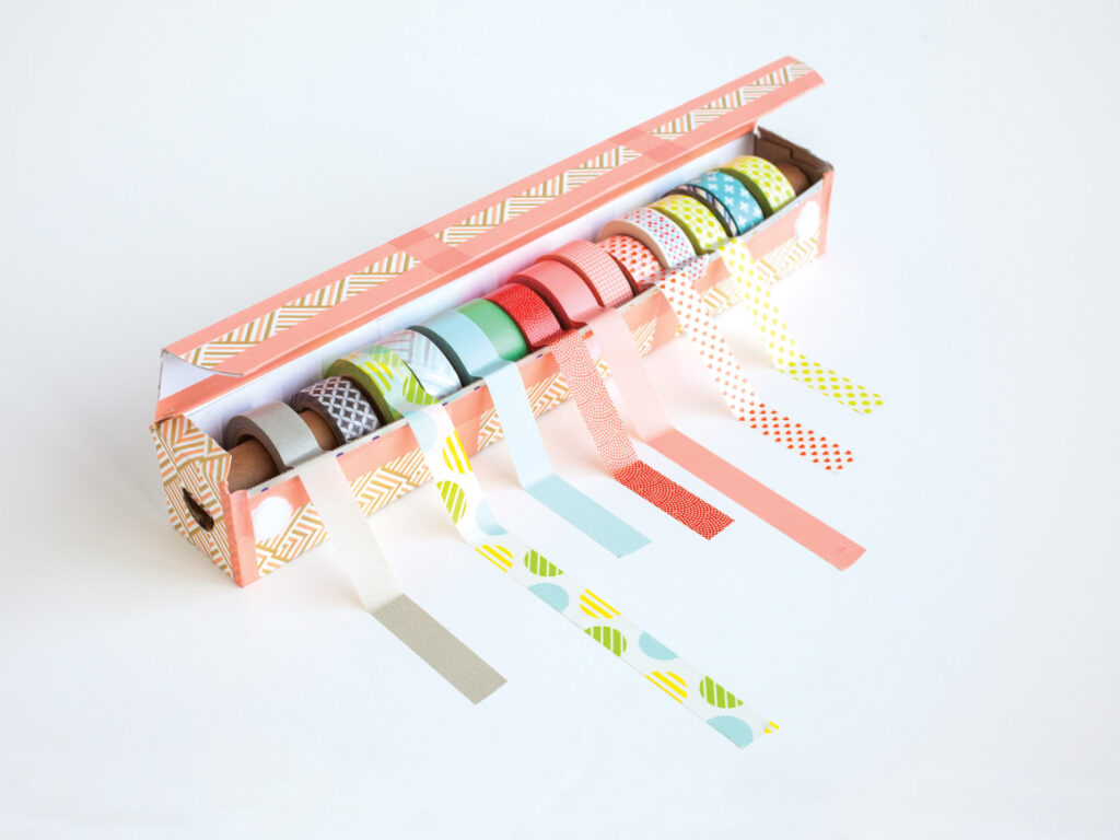 DIY washi tape dispenser made from an empty aluminum foil box and tube