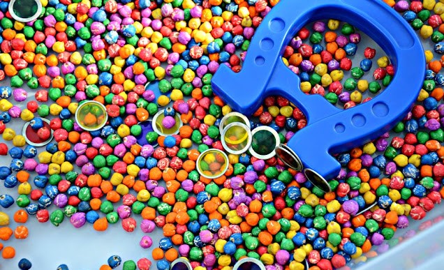 colorful magnet sensory bin with rainbow dyed chickpeas for kids sensory play
