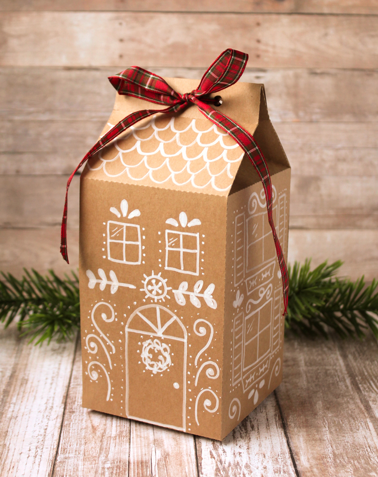 Treat boxes that look like gingerbread houses to package up Christmas goodies in a cute and unique way