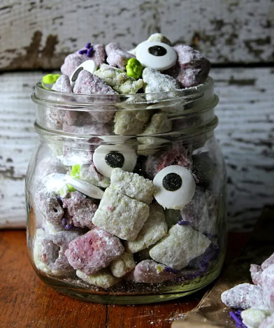 Monster Mash Munch. Made of chocolate and Vanilla Chex coated in green and purple chocolate then powdered sugar