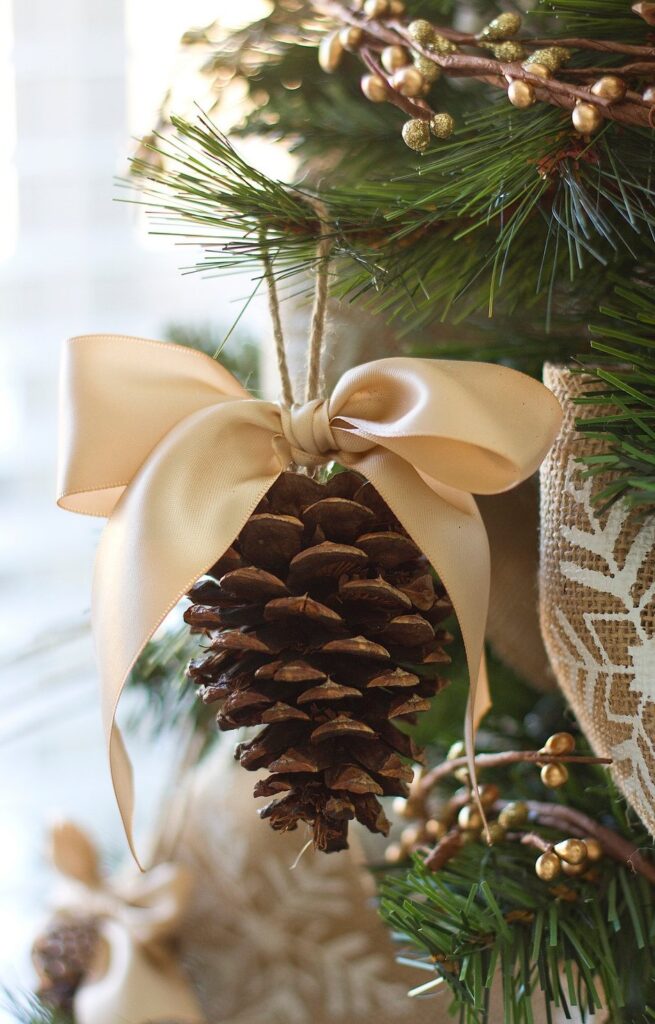 Pine cone with bow ornament
