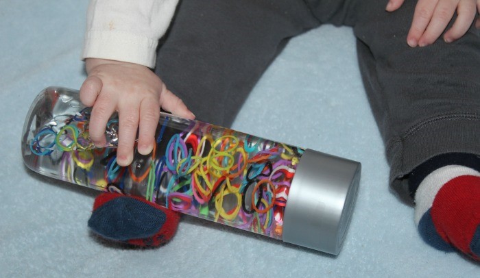 Rainbow loom sensory bottle for kids to play