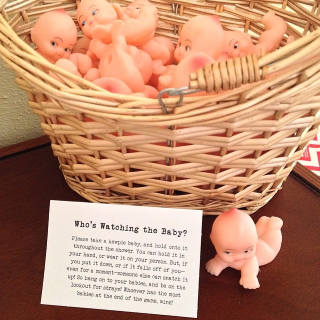 a basket full of itty bitty kewpie dolls for the Who's Watching the Baby? game