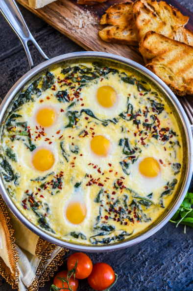 Baked Eggs in Ricotta Parmesan Creamed Spinach