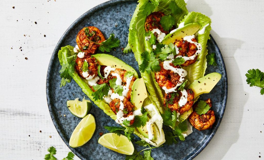 cilantro-lime shrimp wraps drizzle with sour cream, and garnish with cilantro